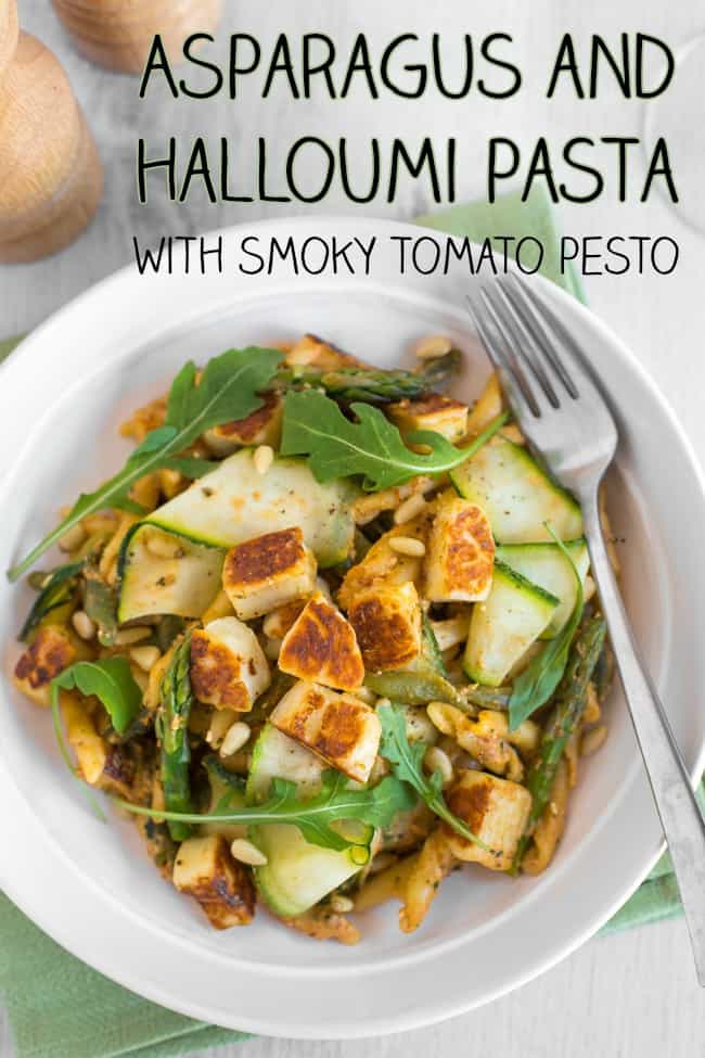 Overhead shot of a bowl of pasta with courgette ribbons, asparagus and crispy halloumi.