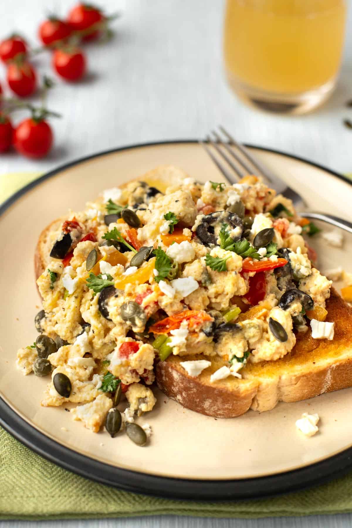 Mediterranean scrambled eggs with feta cheese and vegetables.
