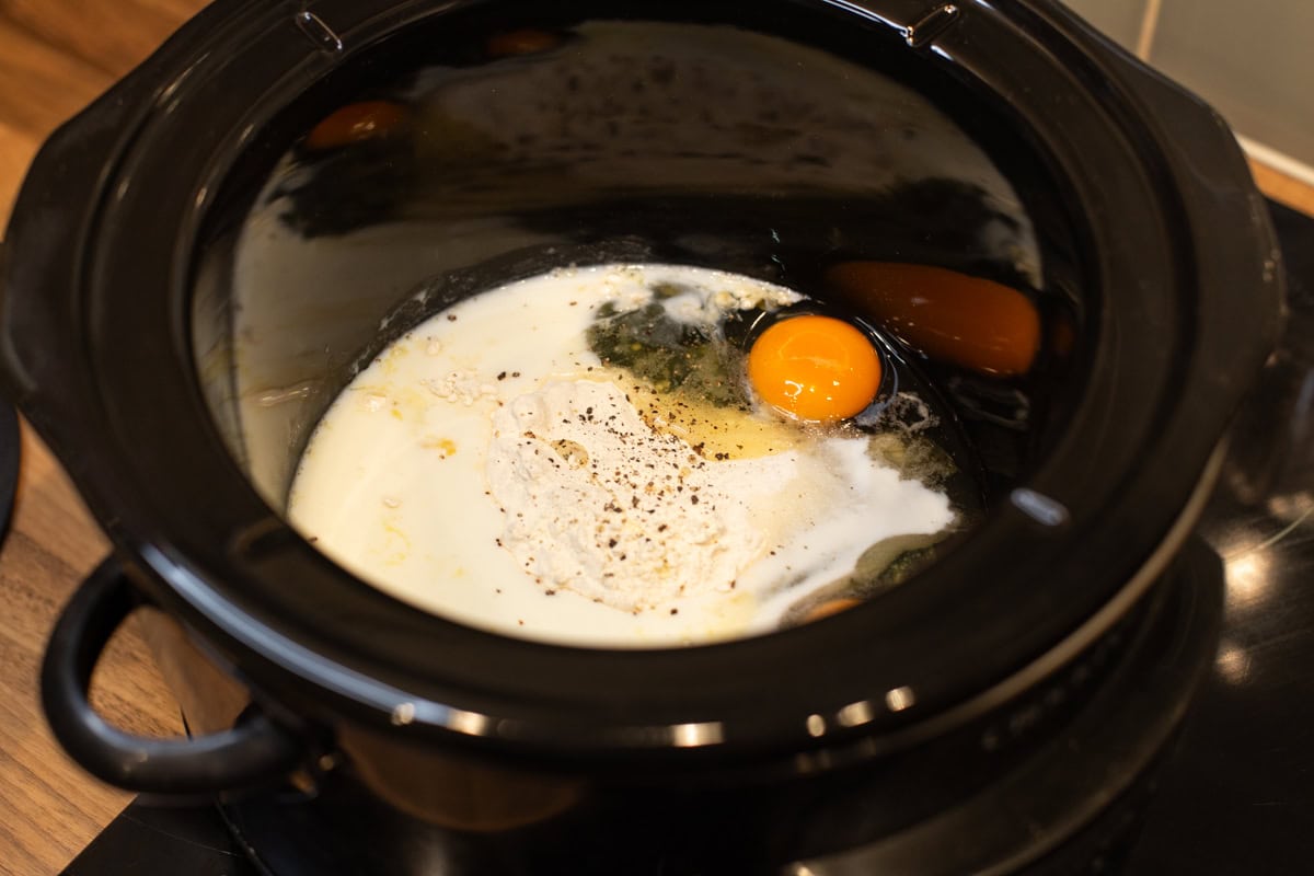 Milk, flour and eggs in a slow cooker.